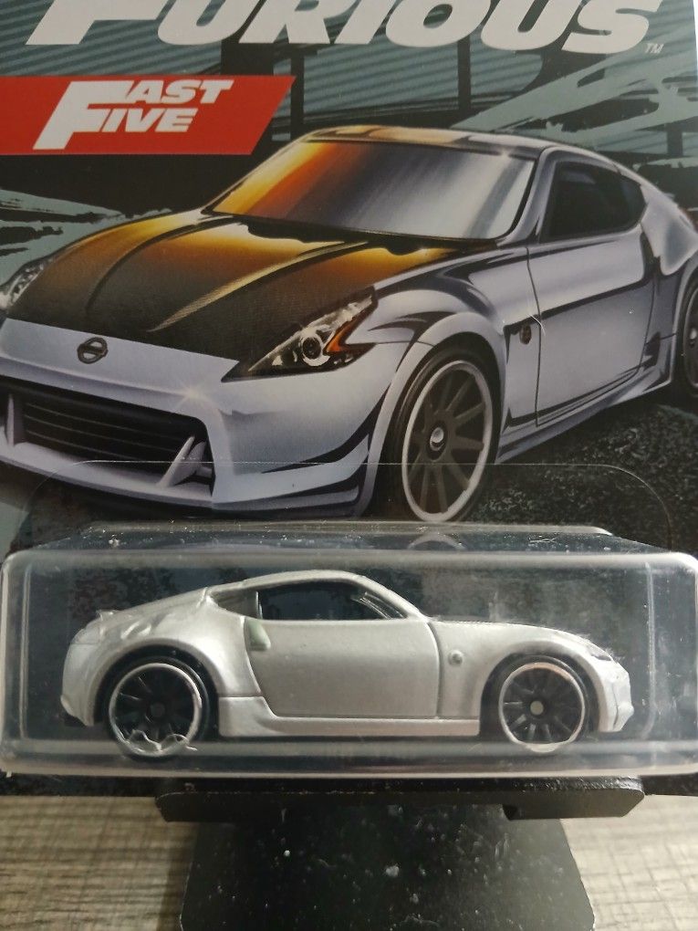 Hot Wheels Fast & Furious Nissan 370Z, specifically part of the "Fast Five" series and marked as 5/6