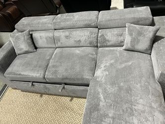 CLEARANCE $849 Reversible Storage Sleeper Sectional with Wireless Charging Pad BRAND NEW IN THE BOX