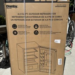 Un-opened Danby mini fridge 