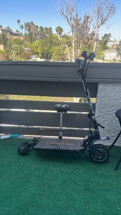 Electric scooter!! NEEDS two tires replaced and needs charger but still works !!!