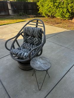 Outdoor chair with cushion and side table