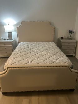 Upholstered queen bed with mattress and box spring