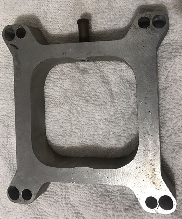 FORD ? ALUMINUM CARBURETOR SPACER. THINK IT CAME OFF A 71 AMC AMX FOUR