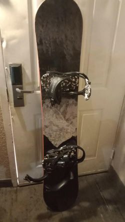 Brand new snowboard and snowsuit and boots googles