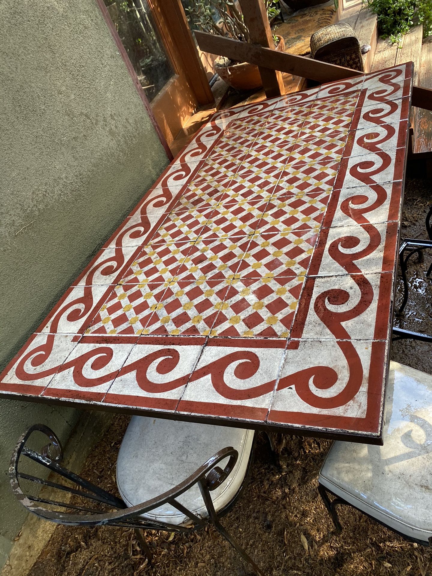 Wrought iron Moroccan tiled table… With free chairs