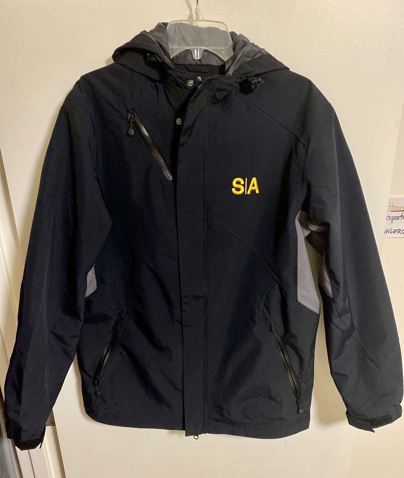 Success Academy Charter School Black Raincoat Jacket Medium Black with gray accents Shell: 100% Nylon Lining: 100% Polyester 