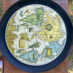 vintage round serving tray with an old world map design
