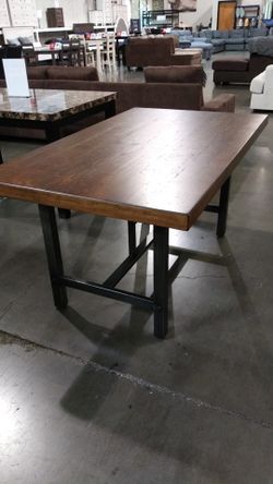 Brown top table with grey woodgrain legs