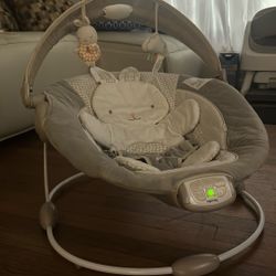 Ingenuity InLighten Twinkle Tails Vibrating Infant Baby Bouncer with Lightning Toy Bar and Pillow