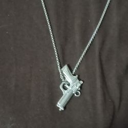 Stainless steel necklace with gun