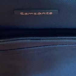 Samsonite Carry On Luggage. (Green) Dimensions are:  14”W — 9”D — 21”H