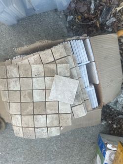 Assorted travertine tiles and pencils