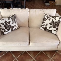 Beige Sofa with Floral Cushions