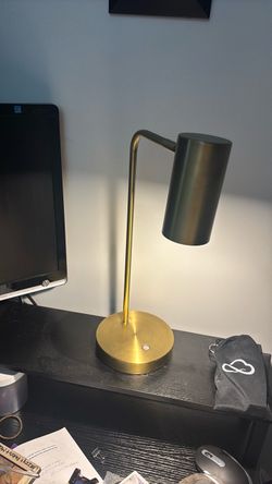 Modern brass desk lamp with swivel head