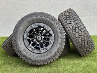 18" Dodge Ram TRX Rims OEM Black Beadlock Wheels 6x5.5 RHO A/T 35" Tires Goodyear 325/65R18 Rebel 