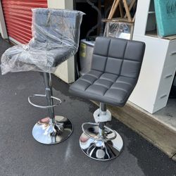 ADJUSTABLE BARSTOOLS ( In Gray Leather) 
