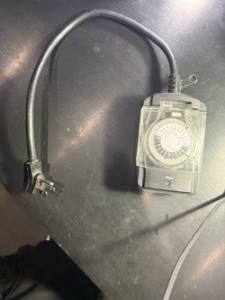 Indoor/outdoor waterproof timer and 3-way plug rated for outdoor use