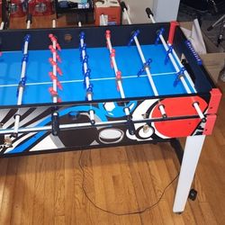 MD Sports 3 In 1 air hockey, foosball and ping pong table.