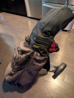 Golf clubs, cart, and bag