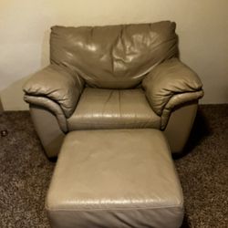 Beige/Camel leather chair and ottoman set.