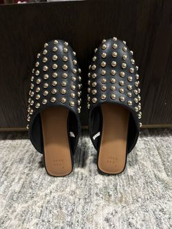 Black faux leather mules