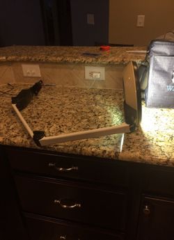 Lamp on moving arm for light and magnifying glass