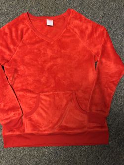 New without tags size large (12-14) women’s red fuzzy sweatshirt with a front pouch