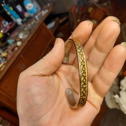 vintage gold and silver tone indented design cut bangle bracelet. 