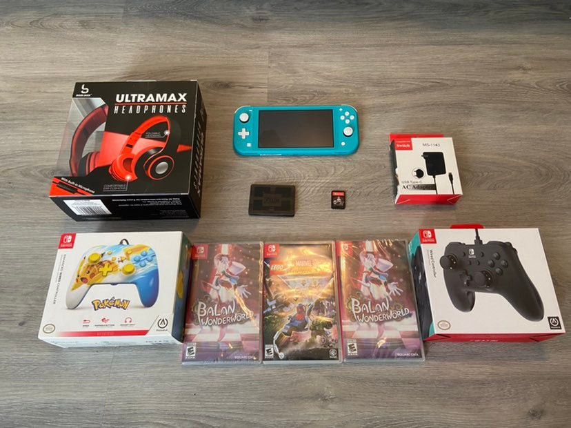 Nintendo Switch Lite in Turquoise with Charger, Games & Controller(s)
