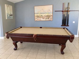 Pool table with sticks and all
