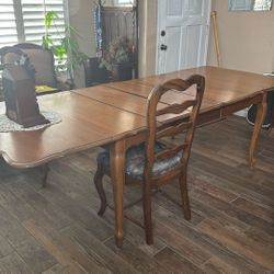 Vintage dining room table And Three Leafs.