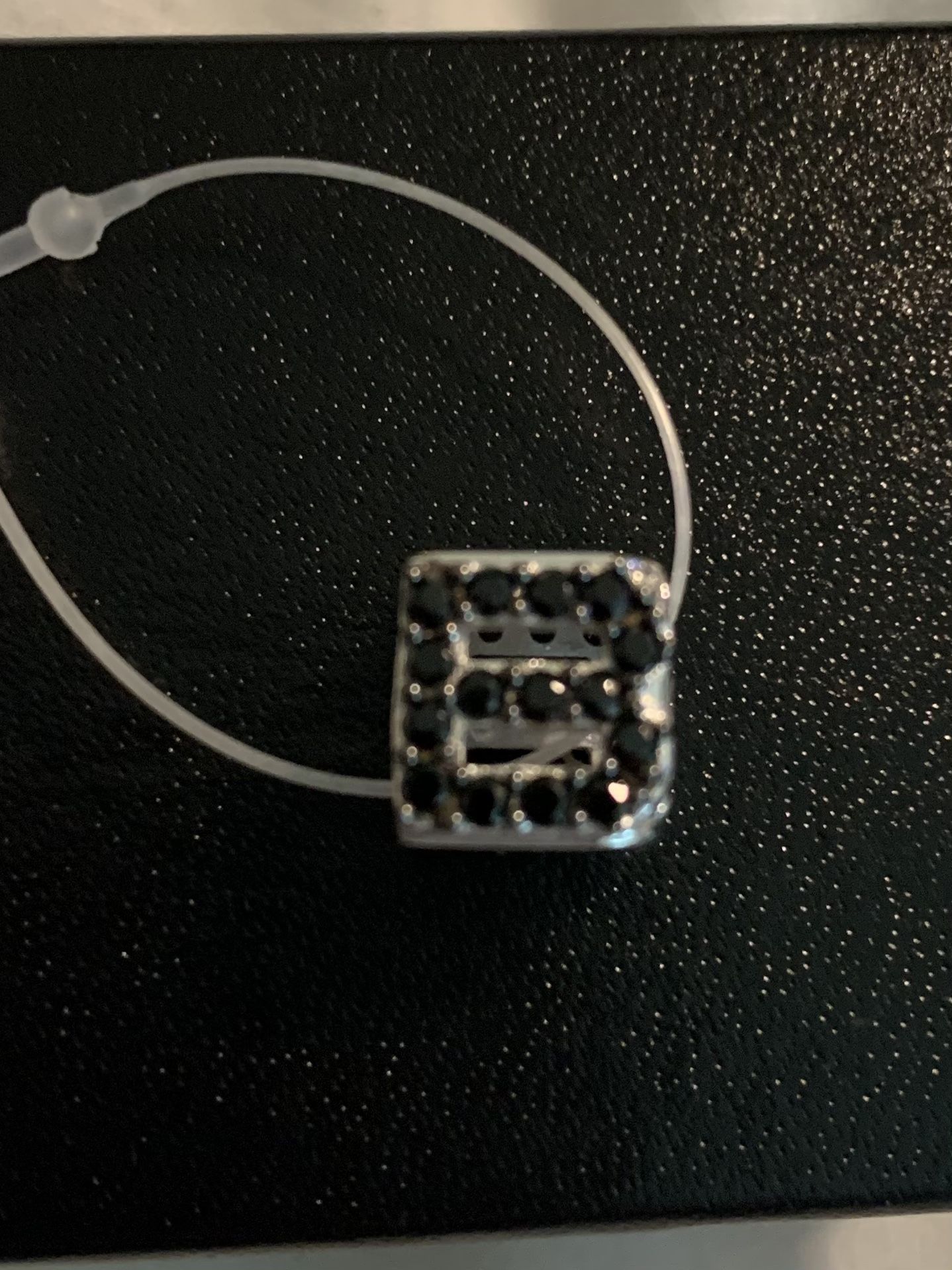 CHARMS - B N L D J Black Spinel On One Side And Topaz