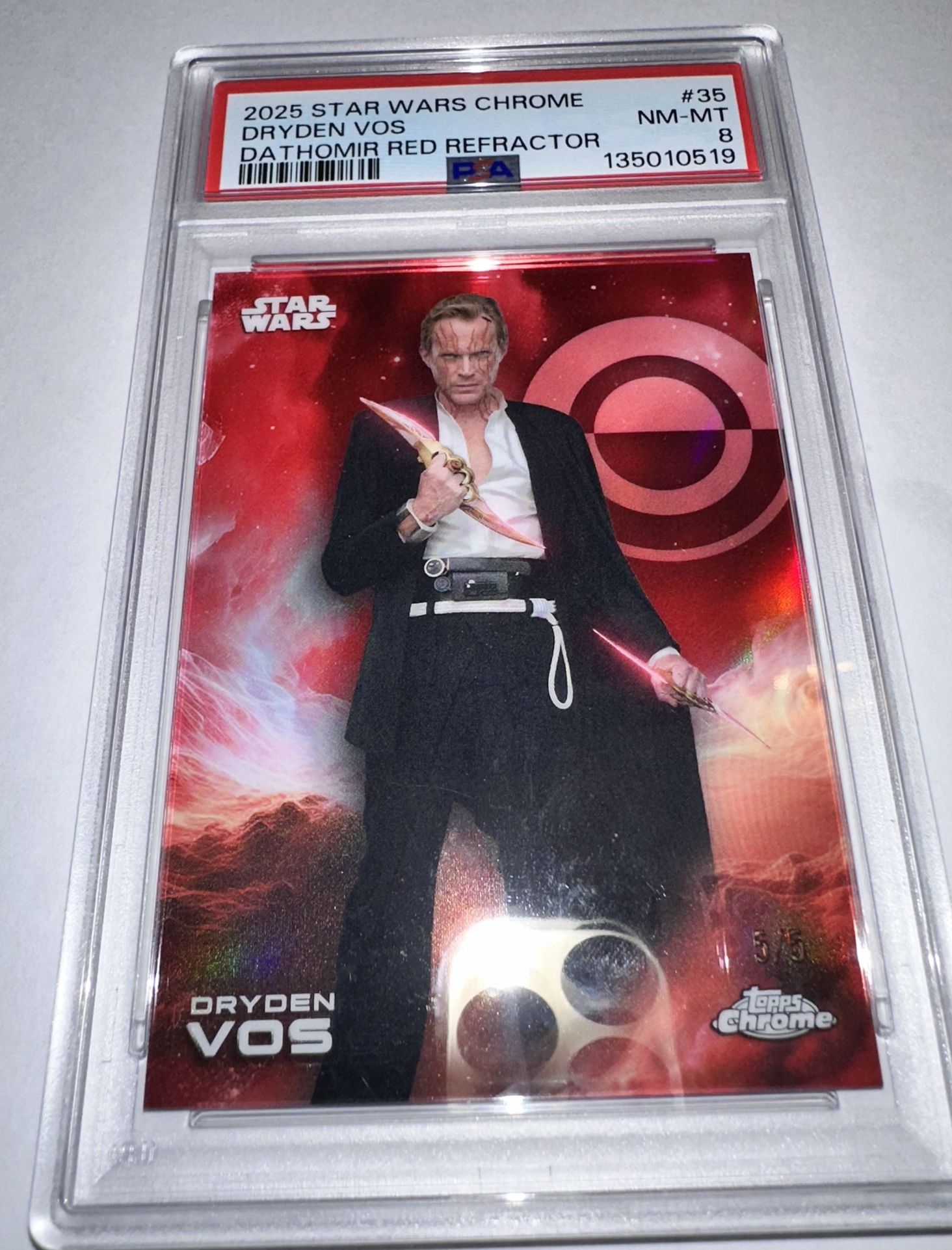 For sale is a 2025 Topps Chrome Star Wars #35 Dryden Vos Dathomir Red Refractor serial numbered 5/5 and graded PSA 8 (POP 1).