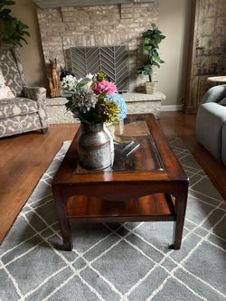 Wood cocktail table with glass insert