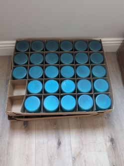 Frosted dark green candle jars.