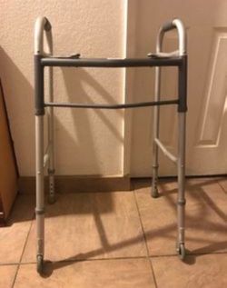 ADJUSTABLE FOLDING METAL WALKER.