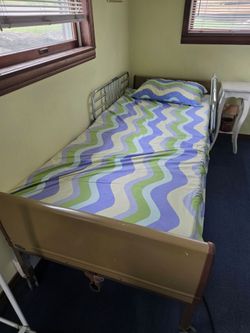 Invacare rising medical bed