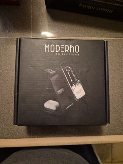 3-in-1 wireless charging station by Moderno Collections designed to charge a phone, earbuds, and a smartwatch simultaneously.