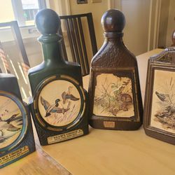 Set Of 4 Antique Beam Whiskey Bottles With Woodland Art