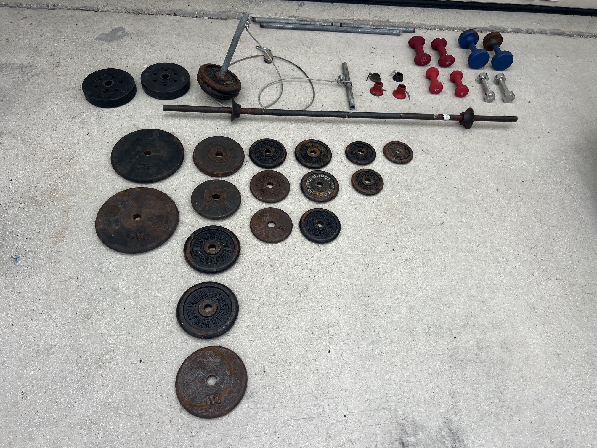A barbell and many fittings for it. You can buy one lot or in parts.