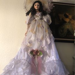 Victorian doll dressed in purple
