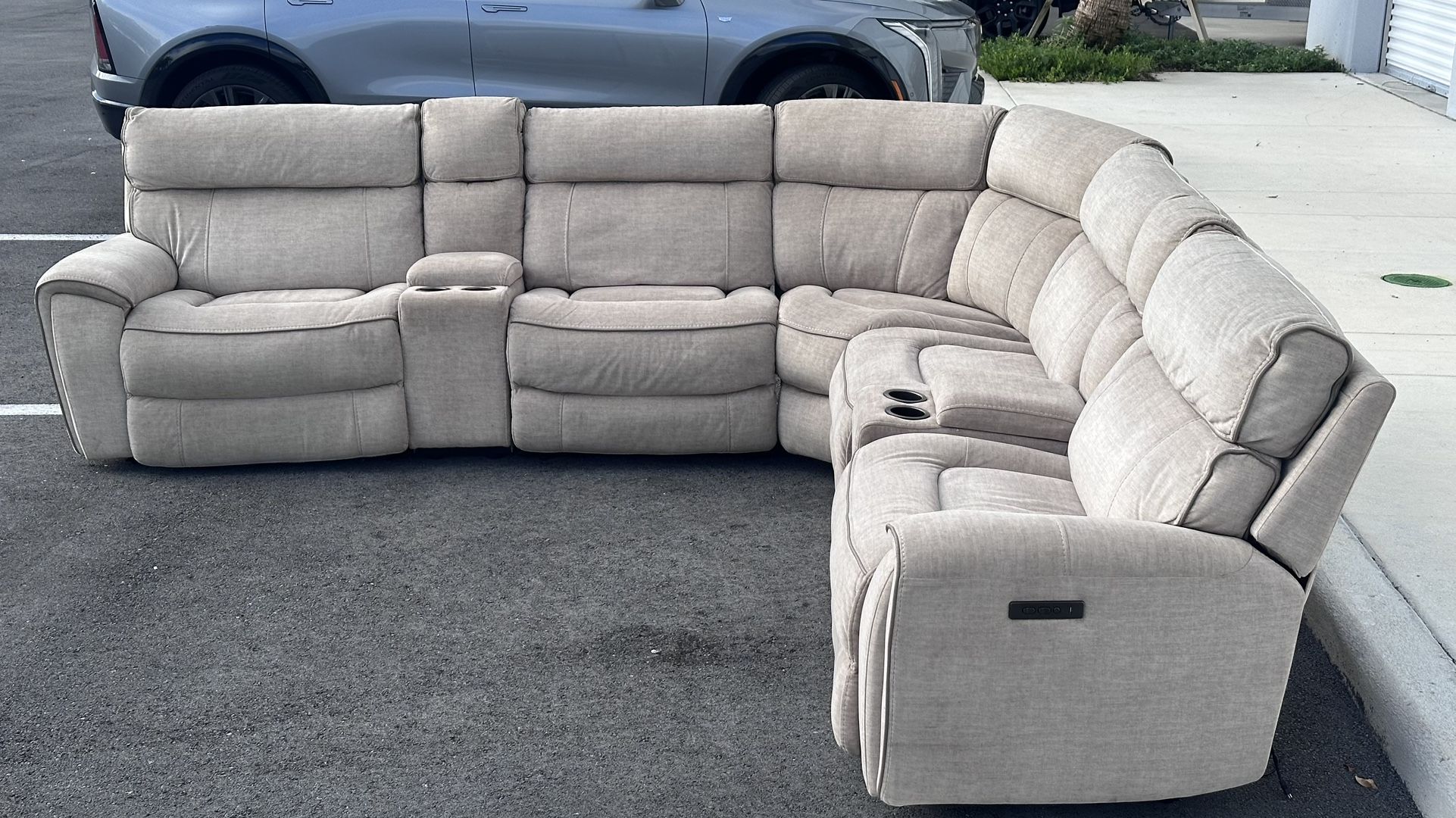 GRAY MODULAR SECTIONAL SOFA w 4 RECLINERS AND USB CHARGER by CITY FURNITURE - delivery is negotiable