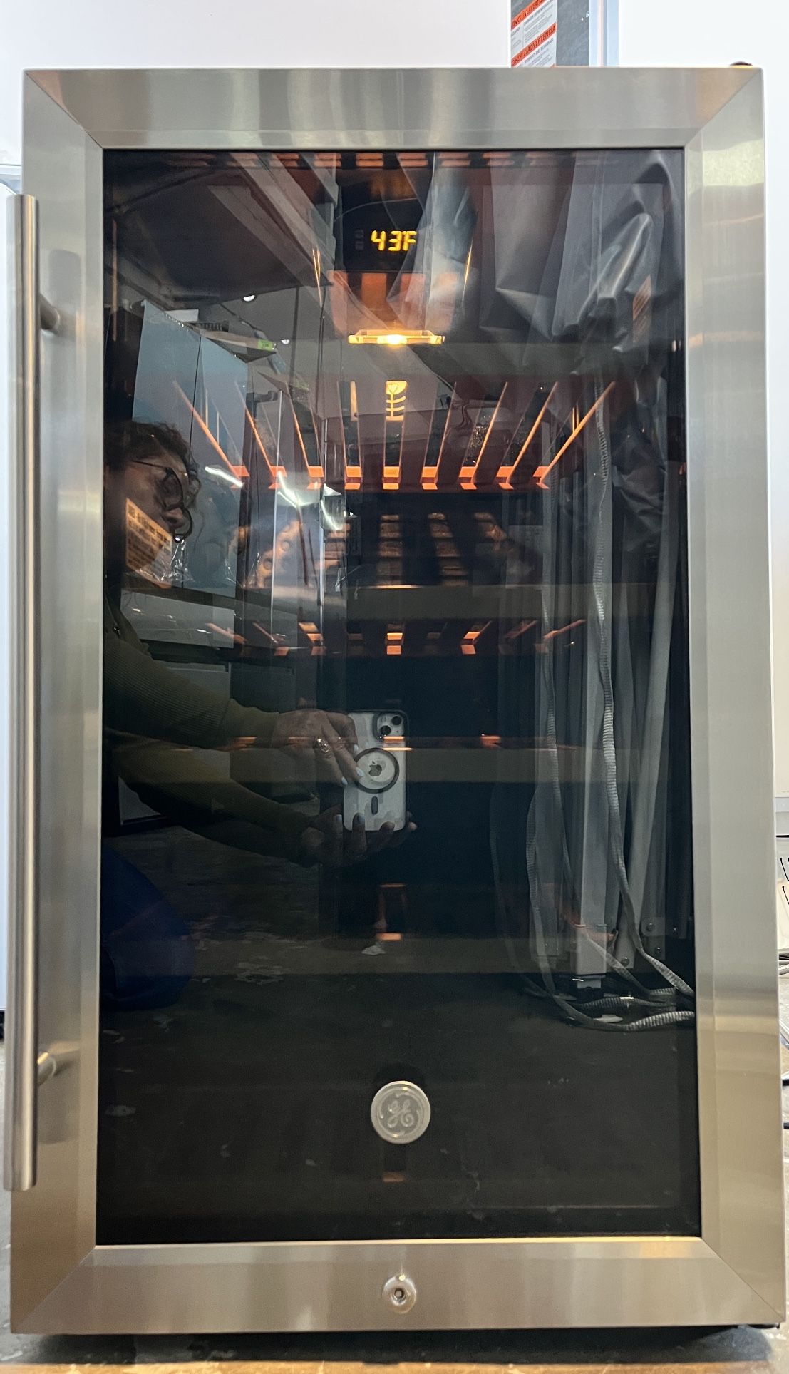 The GE Beverage Center boasts a total capacity of 4.1 cu. ft., accommodating up to 109 cans or 31 wine bottles, making it perfect for entertaining or