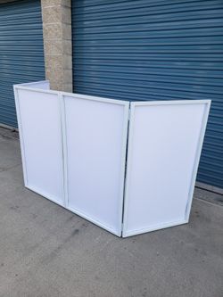 White Facade With Carry On Bag