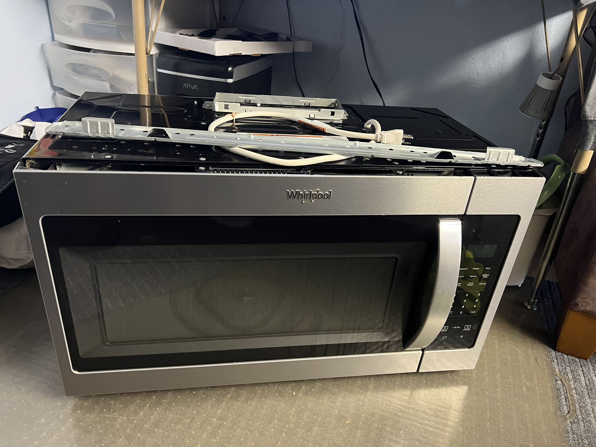 Whirlpool stainless Steel Black Over The Range Microwave/Vent - $150