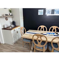wooden dining room table with 6 chairs