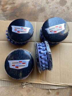 Escalade center caps 83””