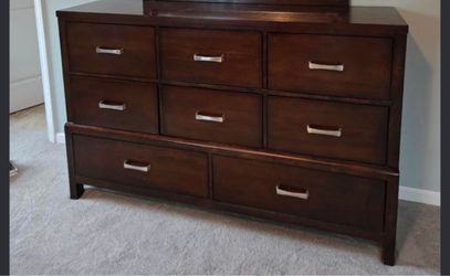 Real wood 3 pc bedroom set 8 drawer dresser 2 drawer night stand with pullout table and queen frame. Good condition one small spot on top dresser that