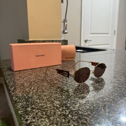 Miu miu Glasses