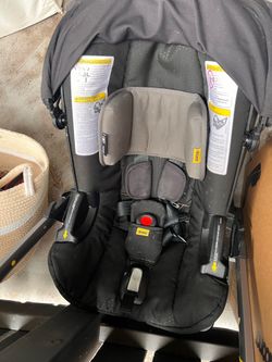 Black Doona car seat with. Base and new base